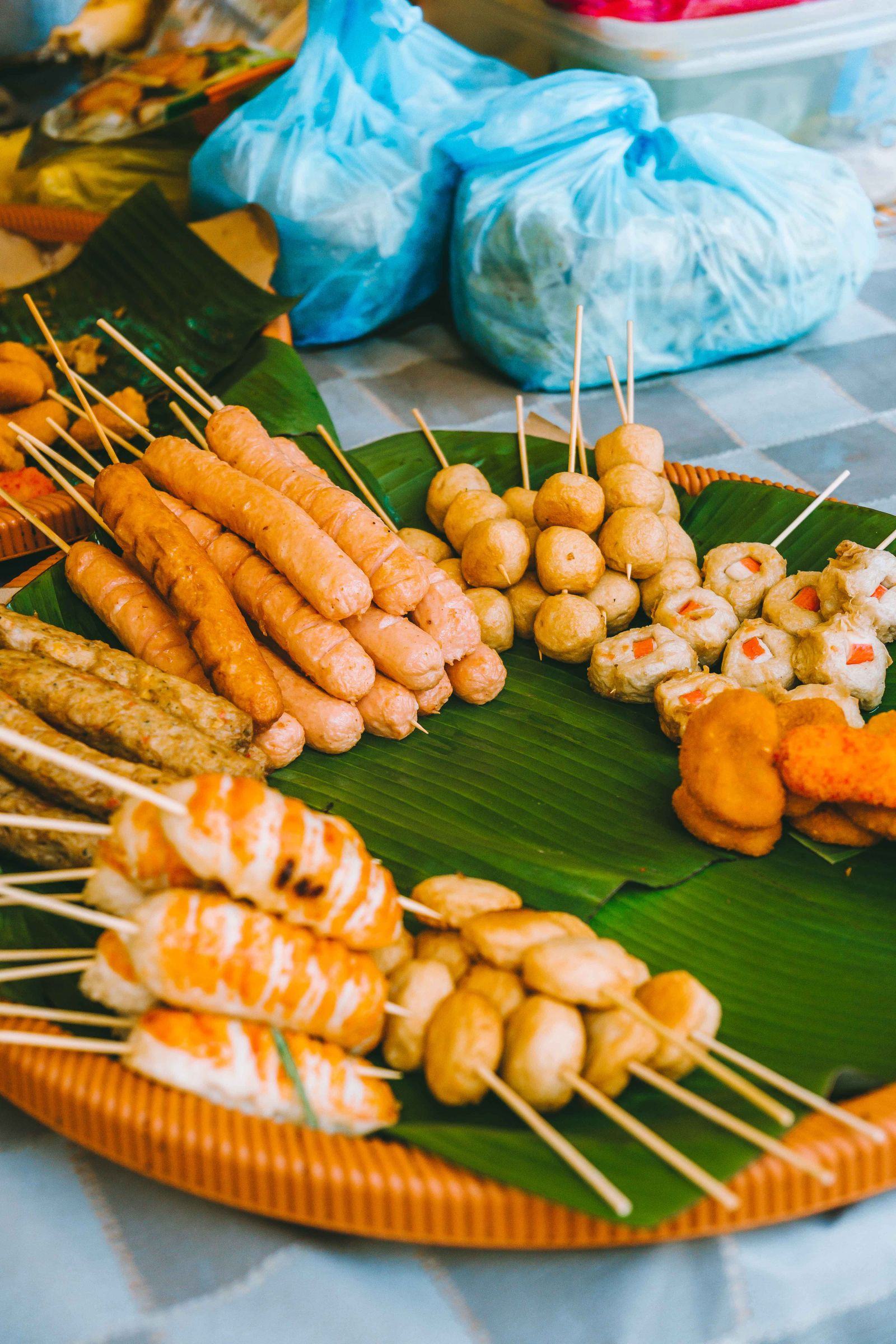 Malaysian street skewers served on banana leaves in Kuala Lumpur
