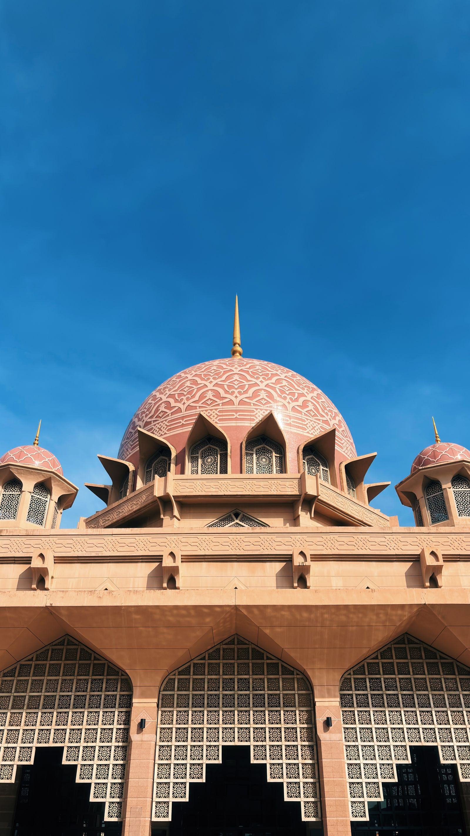 The pink dome of Putra Mosque rising over Putrajaya