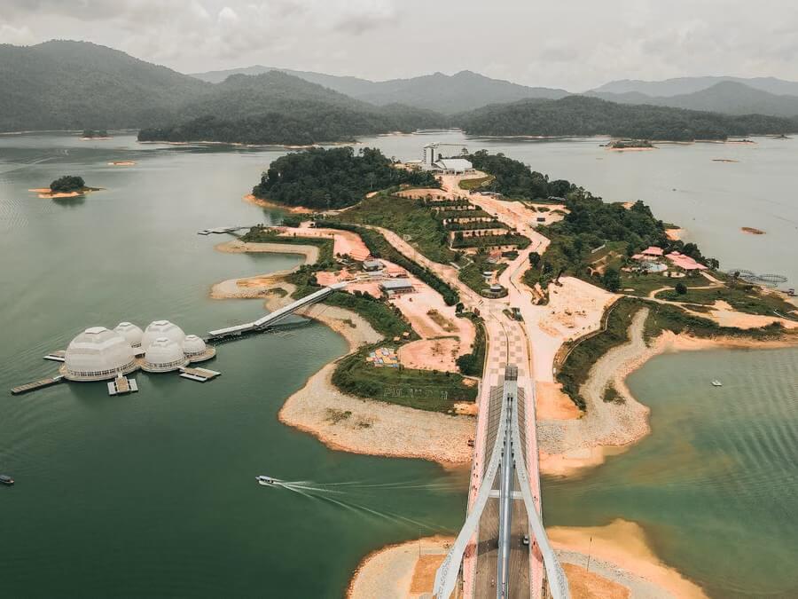 Aerial view of Tasik Kenyir with its bridge, floating domes and forested islands